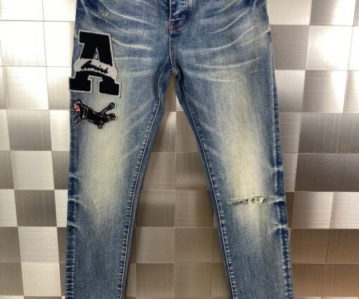 Amiri Varsity Patch Distressed Skinny Jeans Blue Indigo Wash